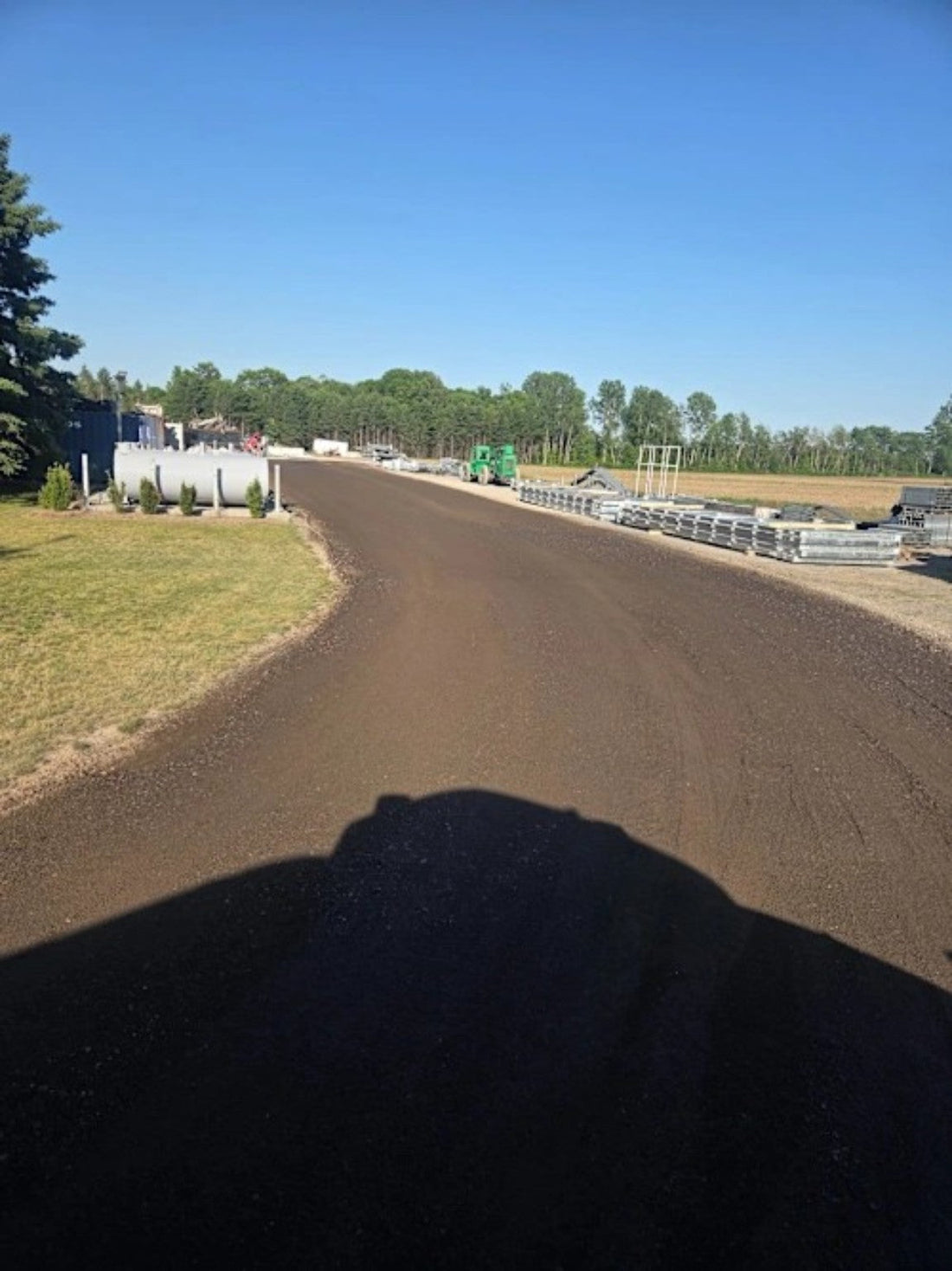 Treated gravel lane after DX7 liquid dust control application
