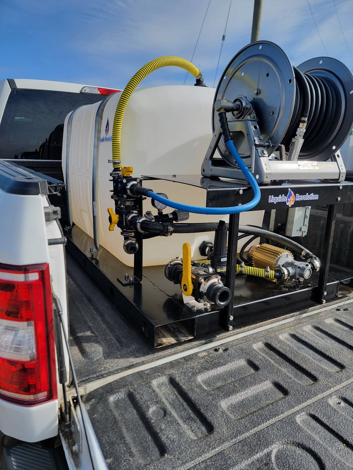Liquids Revolution 200 gallon sidewalk sprayer installed in pickup truck