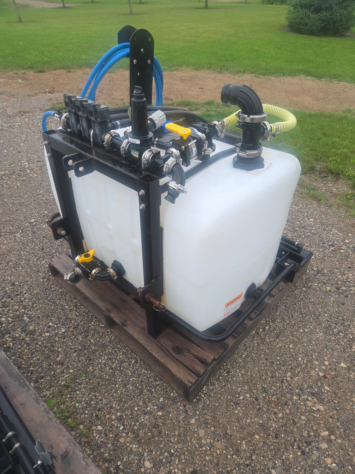 Used Liquids Revolution 100 gallon 3-zone tractor sprayer rear manifold view